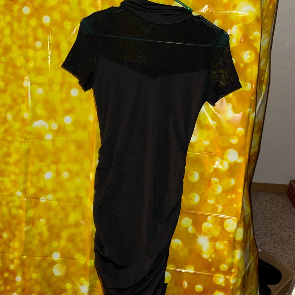 Contrast mesh solid black, mock neck short sleeve dress.